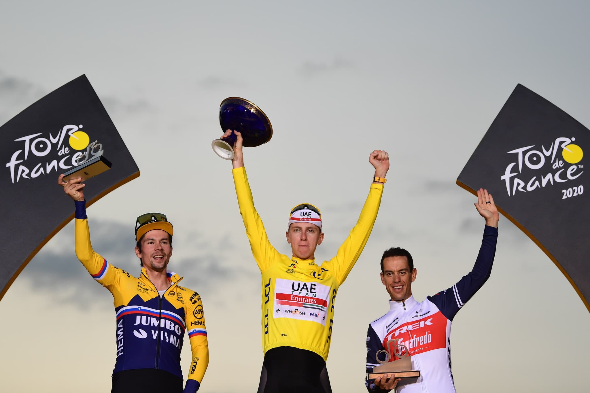 Tadej Pogačar, Wout van Aert, and Richie Porte on the podium at the 2020 Tour de France.