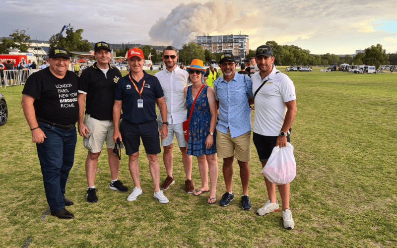Group of people posing outdoors