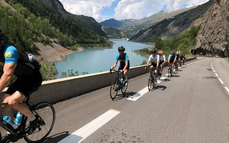 Cyclists riding in the Alps