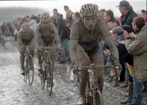 George Hincapie covered in mud