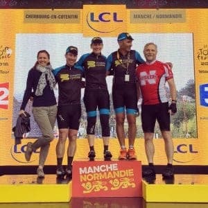 Group on podium, Manche Normandie, possibly Tour de France related