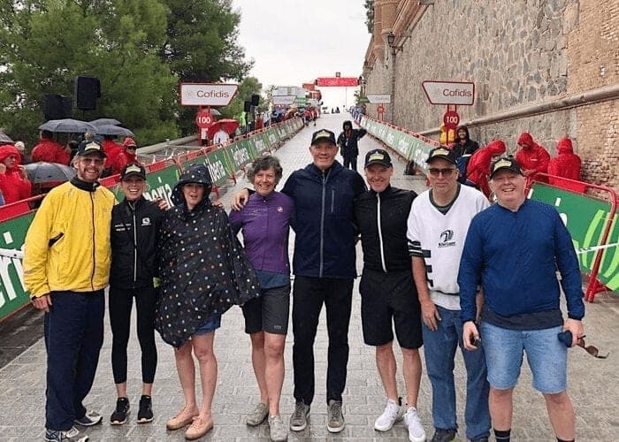 Group of people at a cycling event with Cofidis branding.