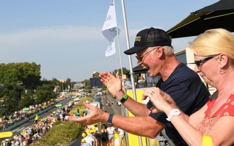 Spectators watch a cycling race from an elevated position.