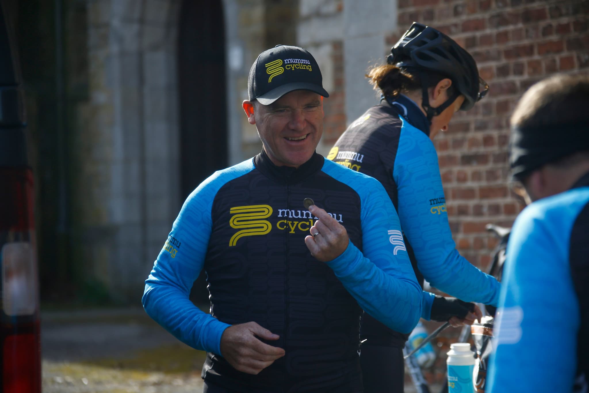 Mummu Cycling staff in branded kit