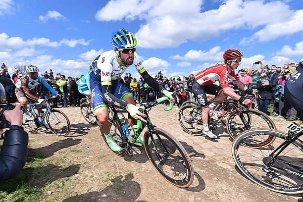 Cyclists on a gravel road, Lotto Dstny and other teams